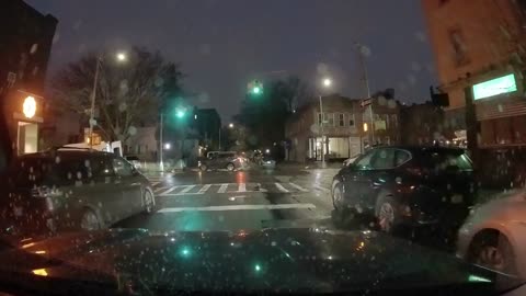 A cyclist and a car ignore red lights.