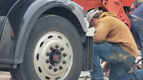 GETTING A NEW STEER TIRE ON THE FREIGHTLINER