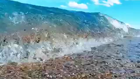 A fantastic wave crashes into the camera,