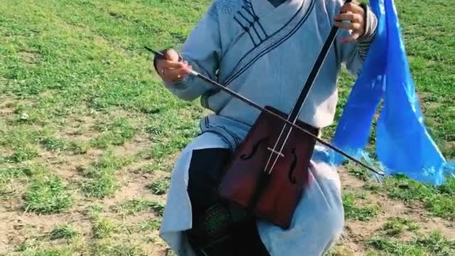 The man is playing the matouqin