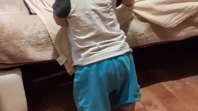 The kid is dancing. Very funny.
