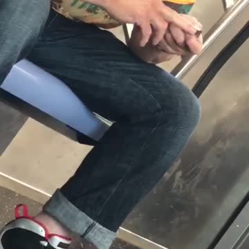 Old guy yellow shirt clipping nails on subway train