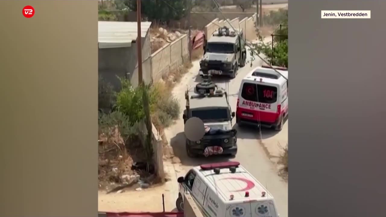 Jewish soldiers in Israel drive with a wounded Palestinian strapped to the hood of a Jeep