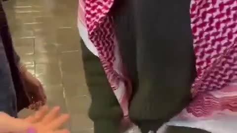 A City College kefiyah-clad student is filmed stealing flyers of kidnapped Israelis