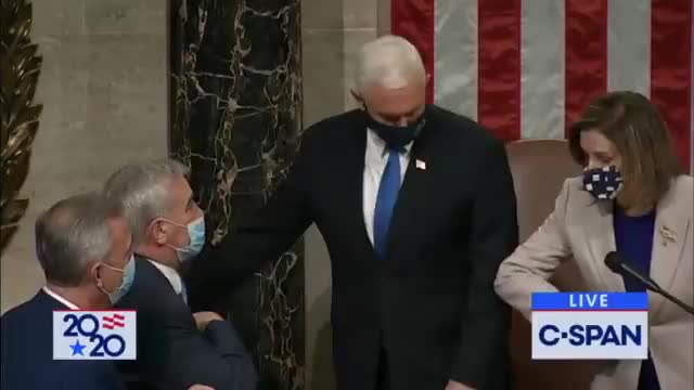 Nancy Pelosi and Mike Pence share an elbow bump