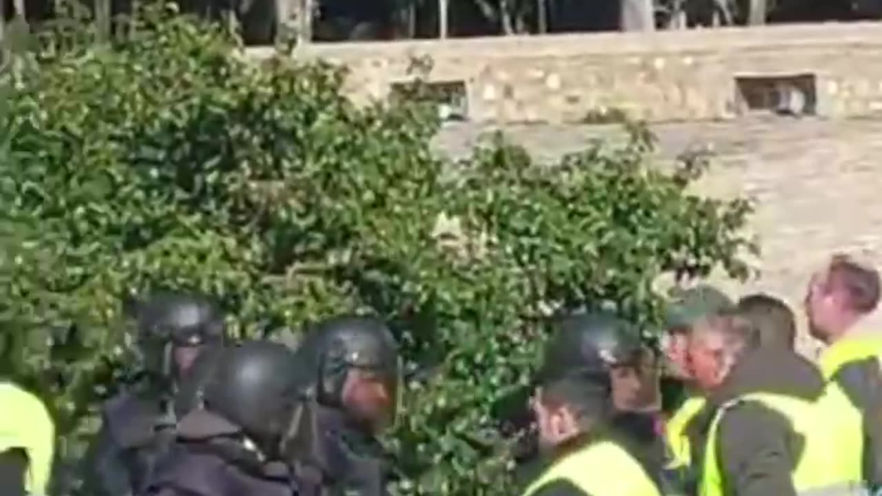 This is a battle between farmers and cops in Spain.