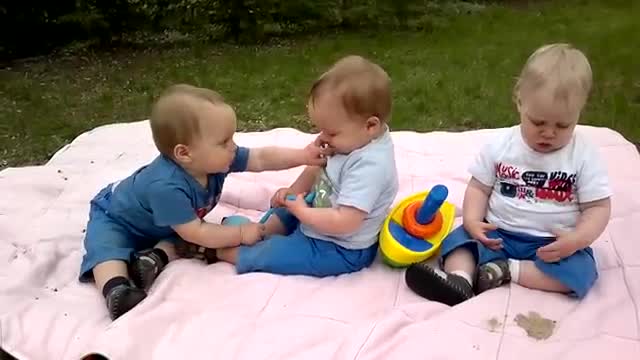 Triplets on their first birthday party.