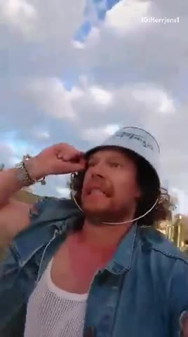 Man with bucket on head hits head