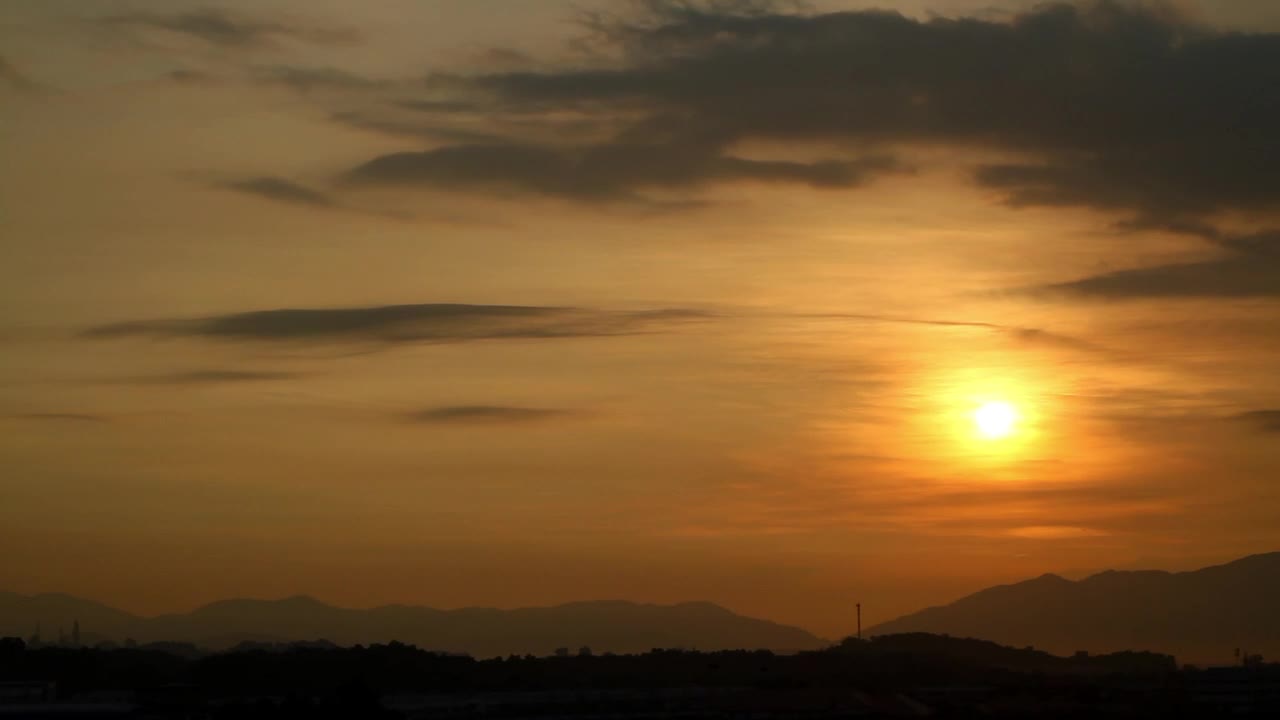 Sun rising above the hills
