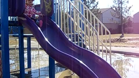 Little Girl Faceplants Off Of Slide Into Giant Puddle