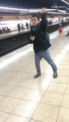 Guy in black jacket dancing with crutch