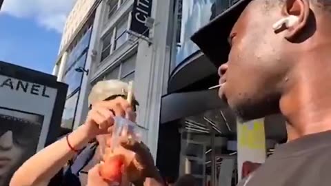 black man terrorizes and steals drinks from tourists in Paris.