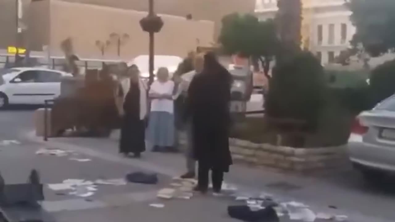 Orthodox monk in Athens destroys heretical Jehovah’s Witness book cart