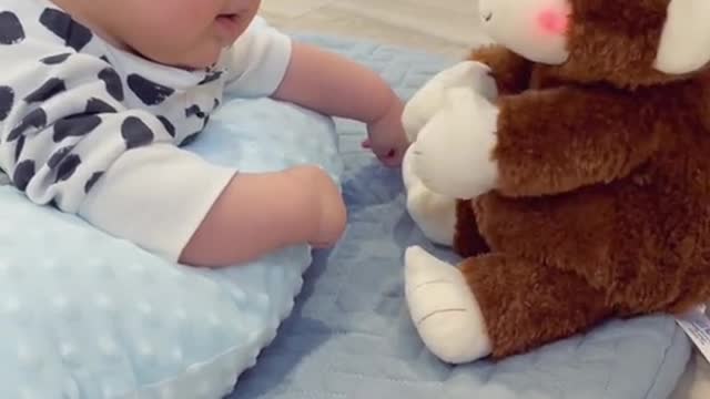 Cute Baby Playing With Teddy Bear