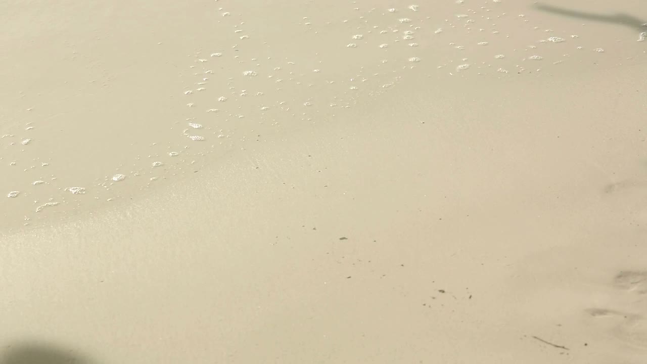 Writing a love sign at the beach
