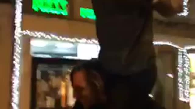 Guy on top of friend faceplants on street