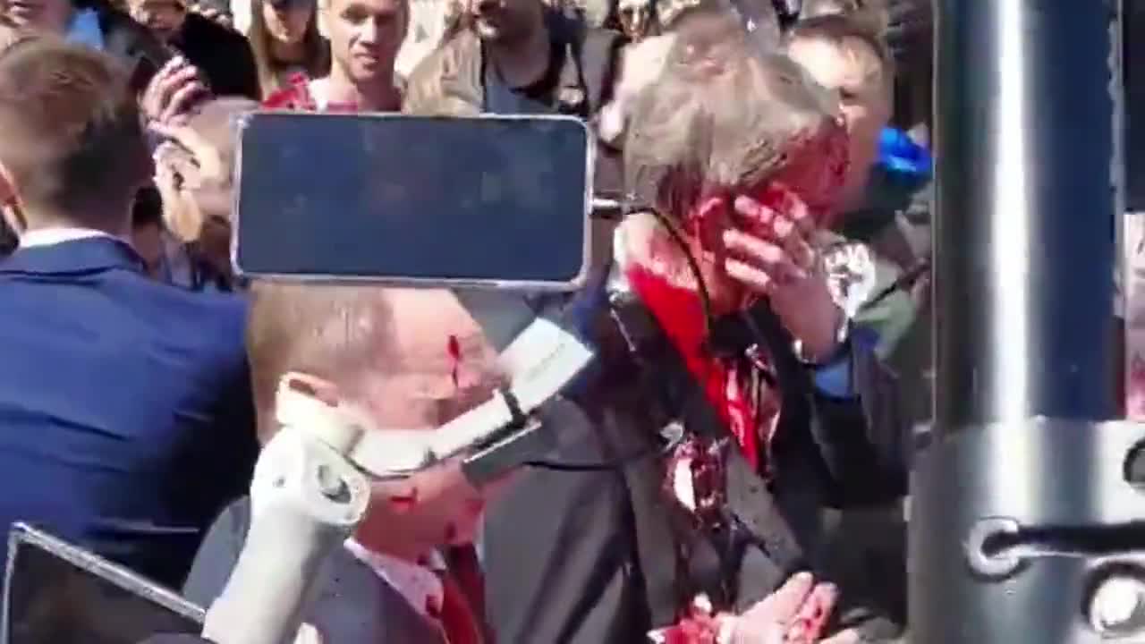 Russian ambassador, Sergey Andreev hit with red paint at Soviet war memorial in Poland.