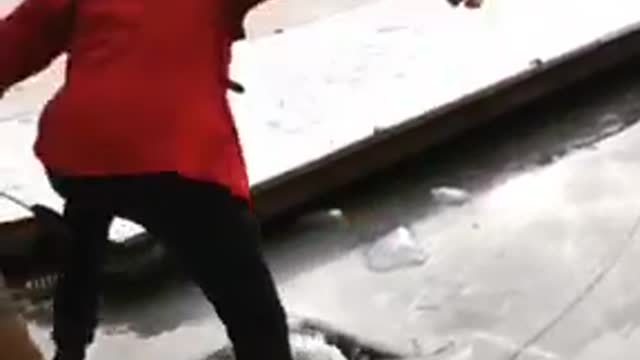 Red jacket guy ice cracks falls into water