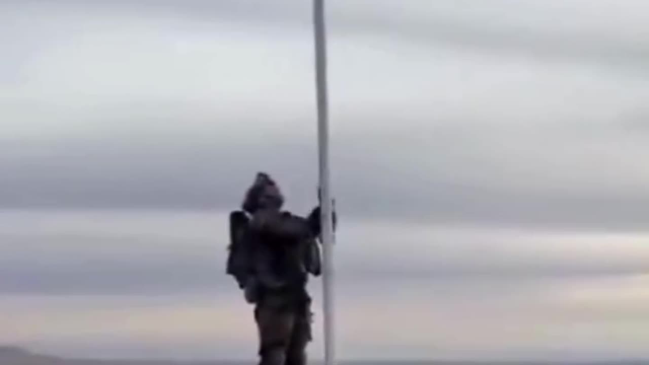 The Israeli flag is raised over Jabal Al-Sheikh in Syria