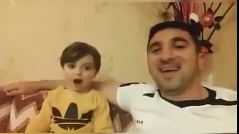 Boy Copying Daddy's Laugh...