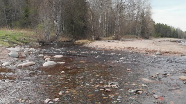 Quadrocopter flies towards the raging river