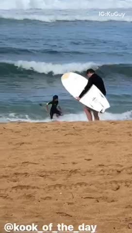 Guy attempts to head out to surf with huge waves approaching