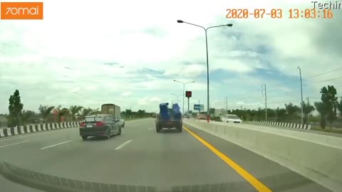 Trash Bins Bail out of Truck Bed