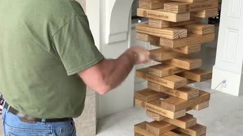 Daring man pulls off impossible oversized Jenga move