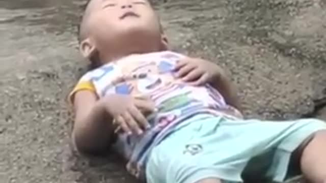 Asian child having fun in the rain