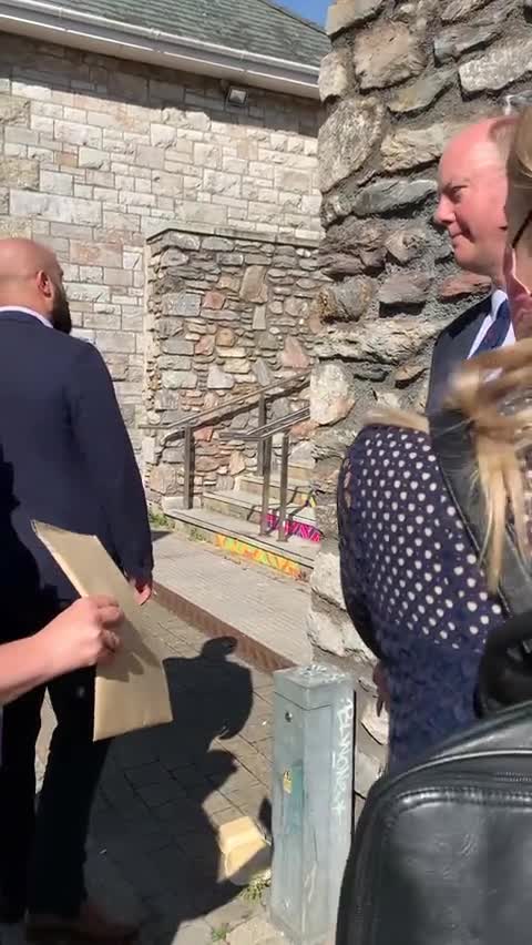 Chris Whitty being served with a liability notice today in Plymouth, refuses to touch it.