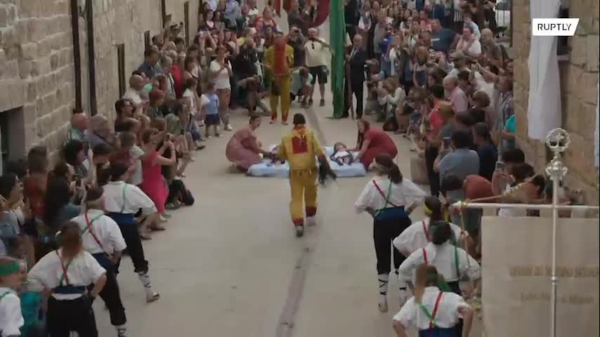 Devils jump over dozens of babies at unusual Spanish village festival