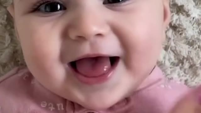 Cute Baby Playing with Mom While Enjoying