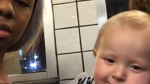 Baby Stares At Woman And Smirks