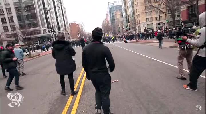 2017 Trump Inauguration: Rioter Launches Large Chuck if Concrete at the Police