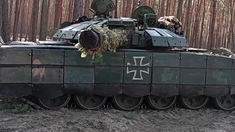 Ukrainian trophy T-72B3 with added dynamic protection.