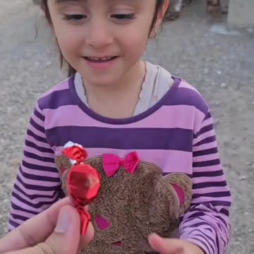 Children very happy to receive toffee from uncle