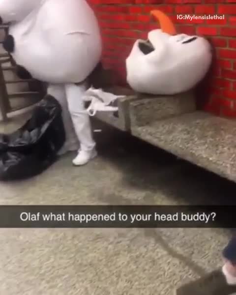Person wears olaf mascot costume and head falls off, subway station