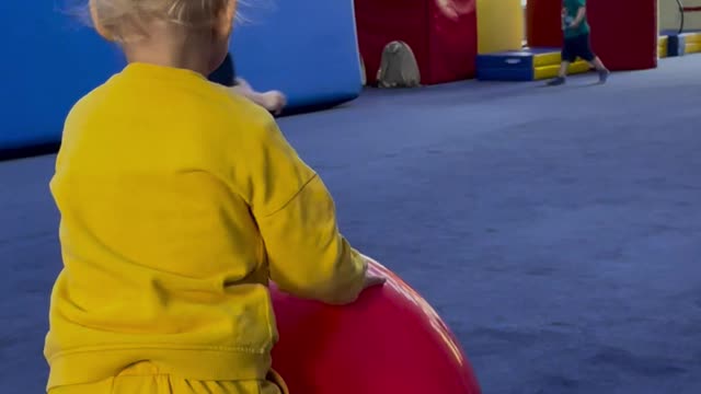 Many Baby Kids Are Playing With Colorful Balls
