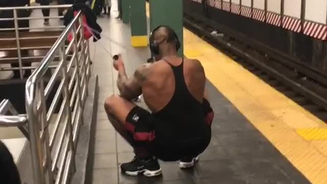 Man in black shirt exercising arms