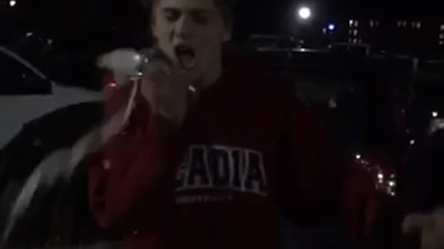 Guy red sweater arm swing smashes beer can on head