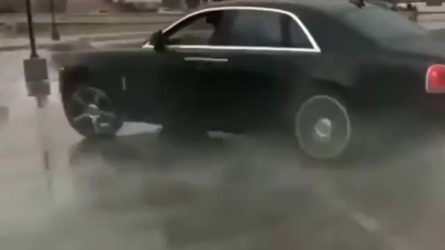 Crazy $500k Rolls Royce Phantom Burnout and Donuts on wet parking lot!!