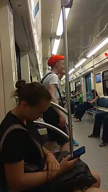 Guy orange hat dancing subway