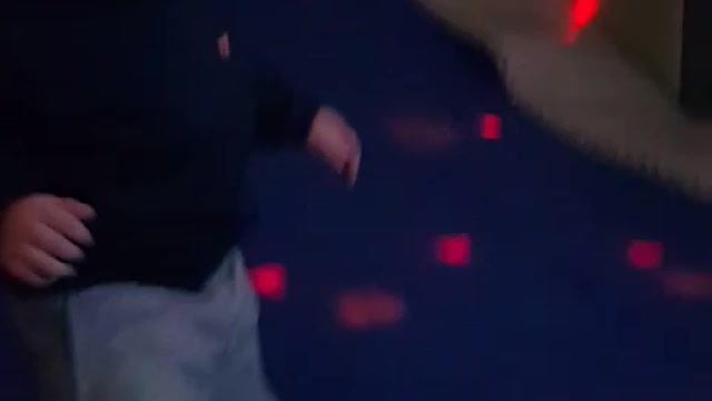 This is a video of a baby playing freely on a trampoline.
