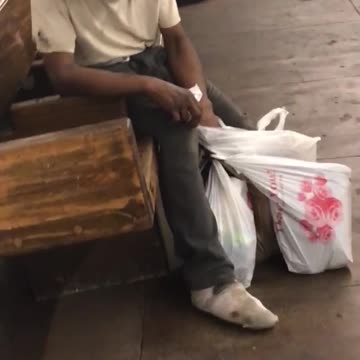 Homeless man straw and pens in his ear