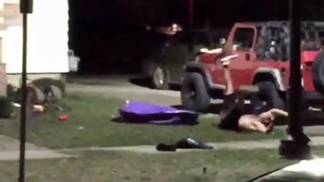 Guy jumping on plastic pool and falling