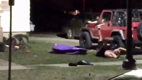 Guy jumping on plastic pool and falling