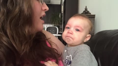 Baby cute reaction when her mom sing