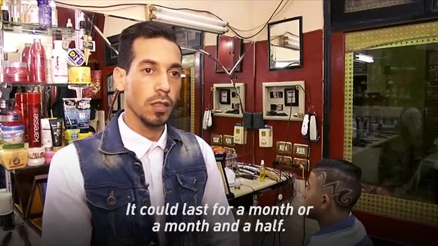 This barber cuts hair with fire
