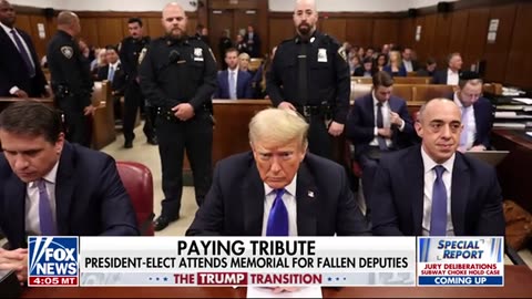 President-elect Donald Trump pays his respect to fallen deputies