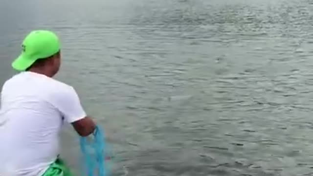 Fishing on beach near town